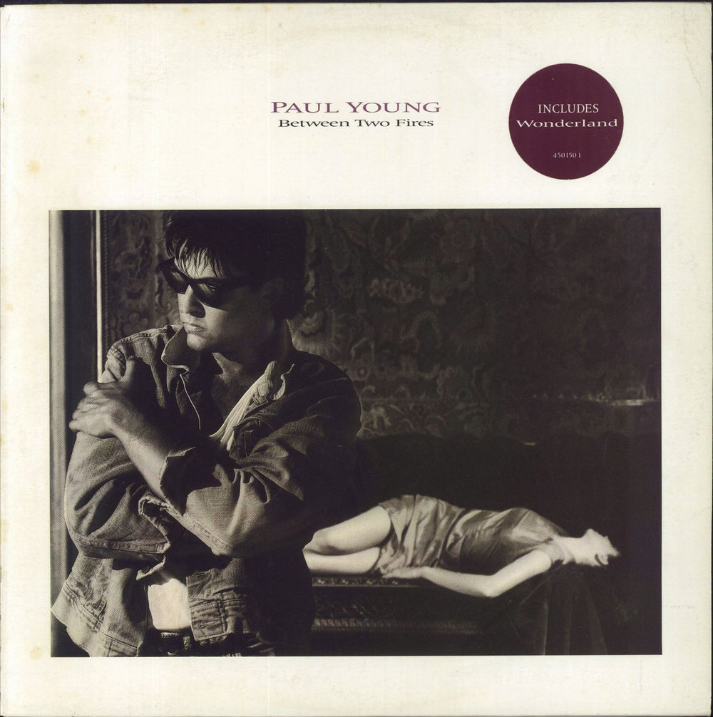 Paul Young Between Two Fires - Promo Stamped Sleeve UK vinyl LP album (LP record) 450150-1